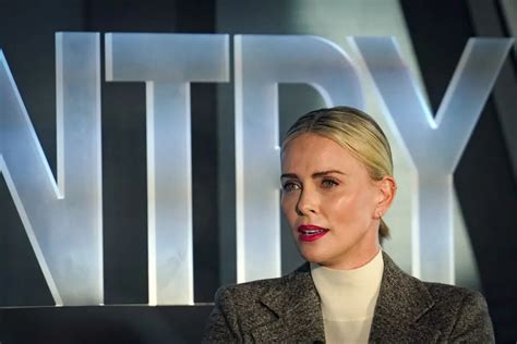 Charlize Theron encourages people to find ways to help through philanthropy at Town & Country summit